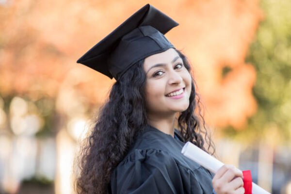 Teenage happy Indian female graduates high school Teenage happy Indian female graduates high school